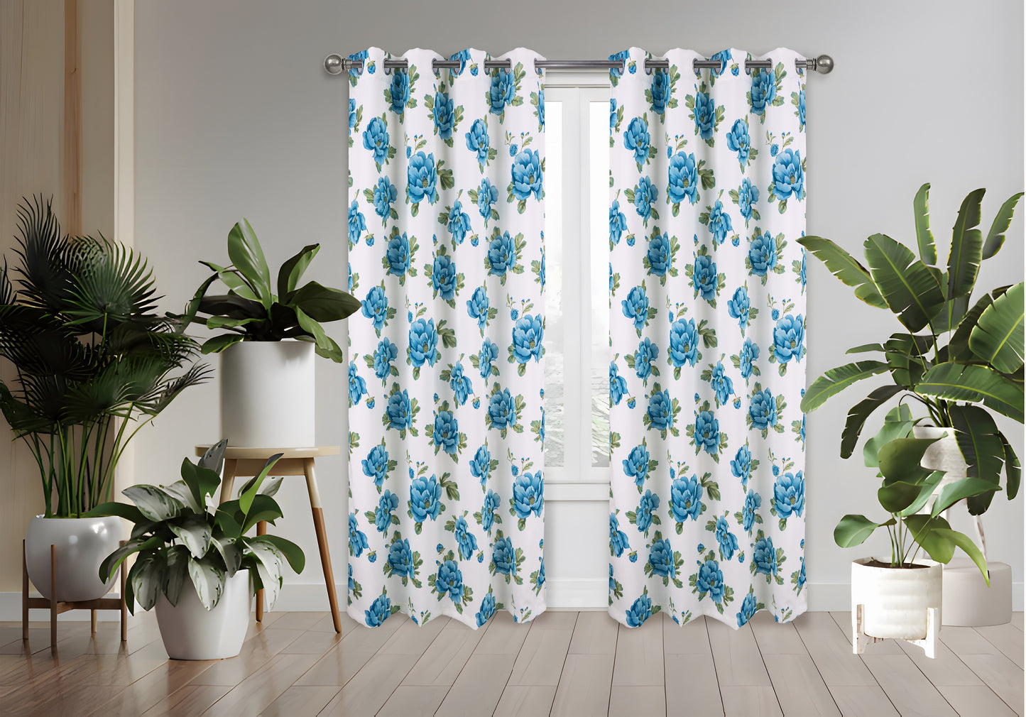 Floral patterned curtains with blue flowers in a room with plants.