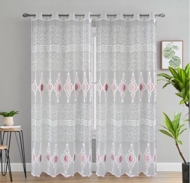 Sheer curtain with geometric pattern in a room setting