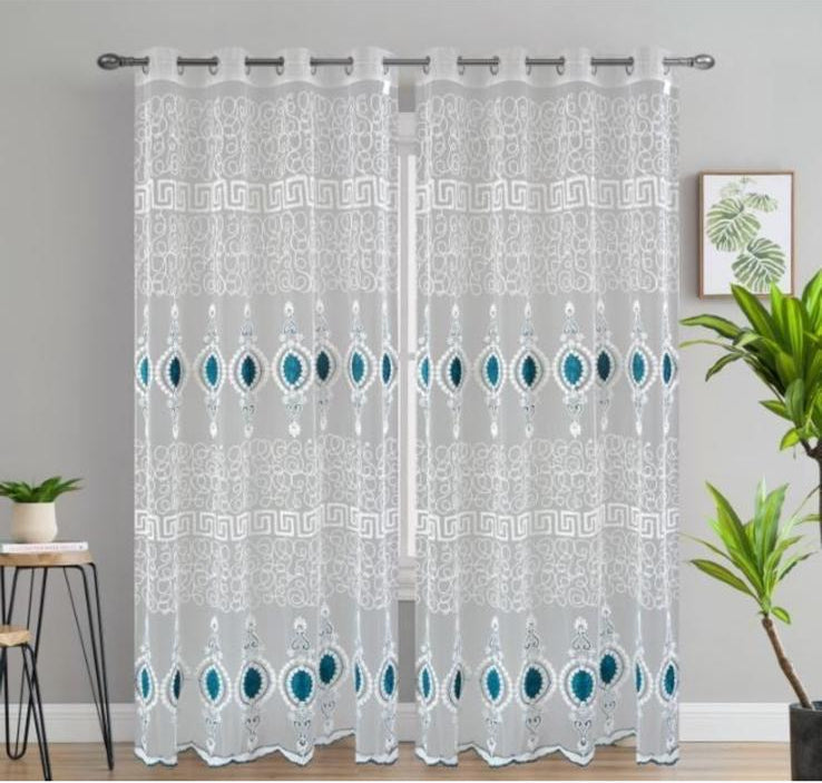 Sheer curtains with a geometric pattern in a room setting