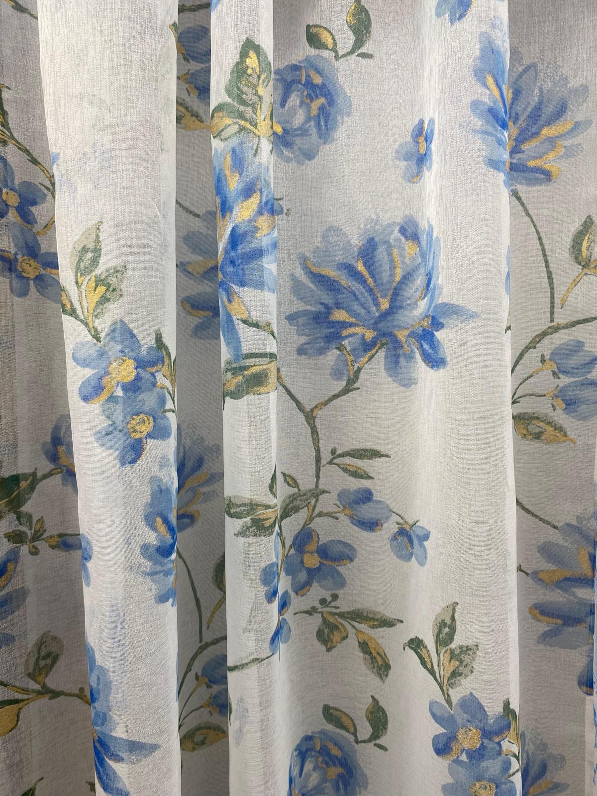Floral curtain with blue flowers and green leaves on a light background
