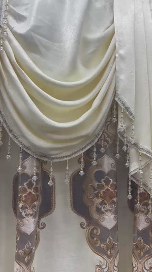 Jenifer beige 7-piece embroidered curtain set with 118-inch wide swag valance displayed in a window